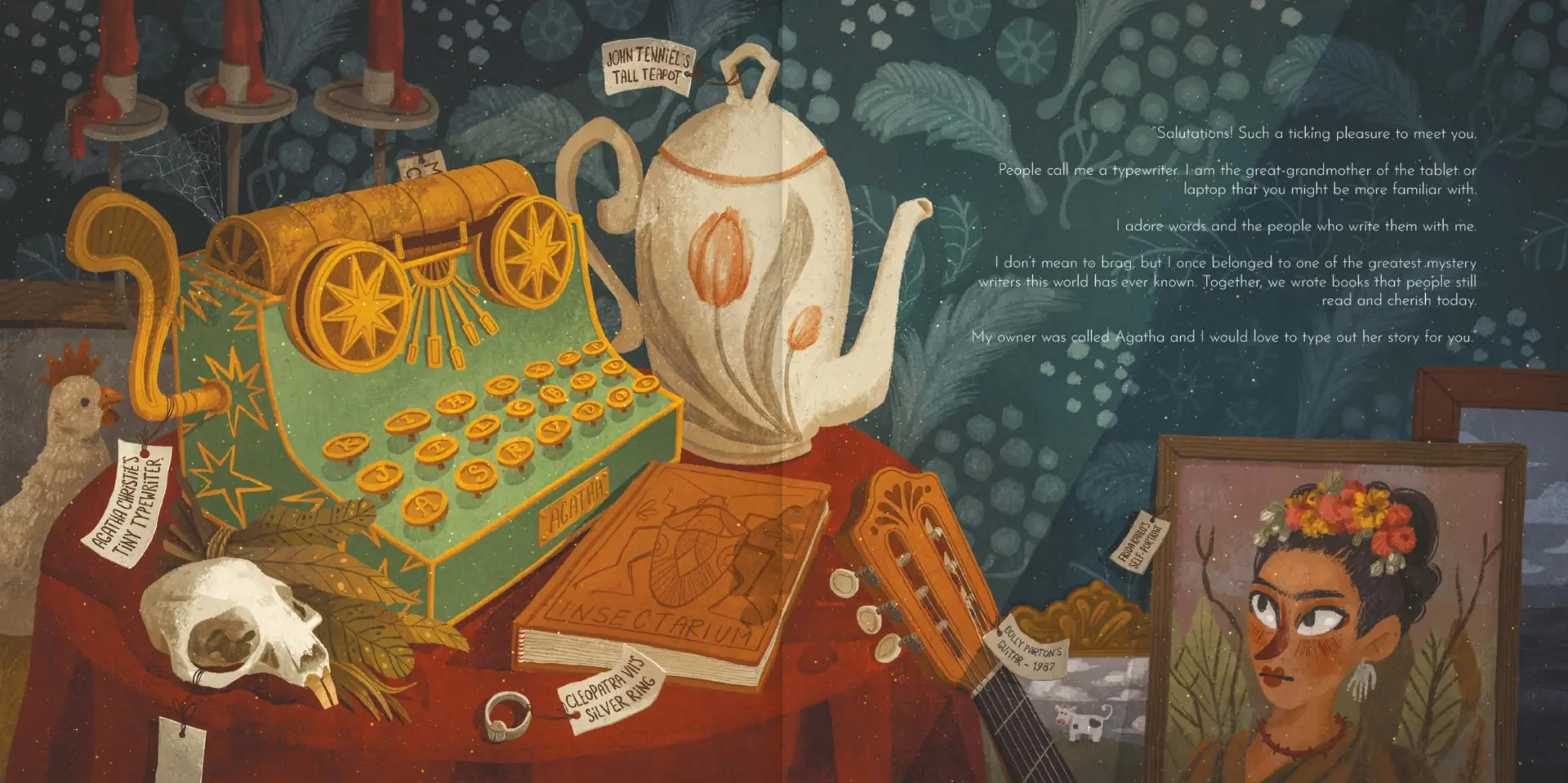 Interior spread from The Tiny Typewriter — the tiny teal typewriter on a rust-clothed table beside a tall teapot, a silver ring, a guitar and a framed self-portrait, with the typewriter's greeting printed at the top right
