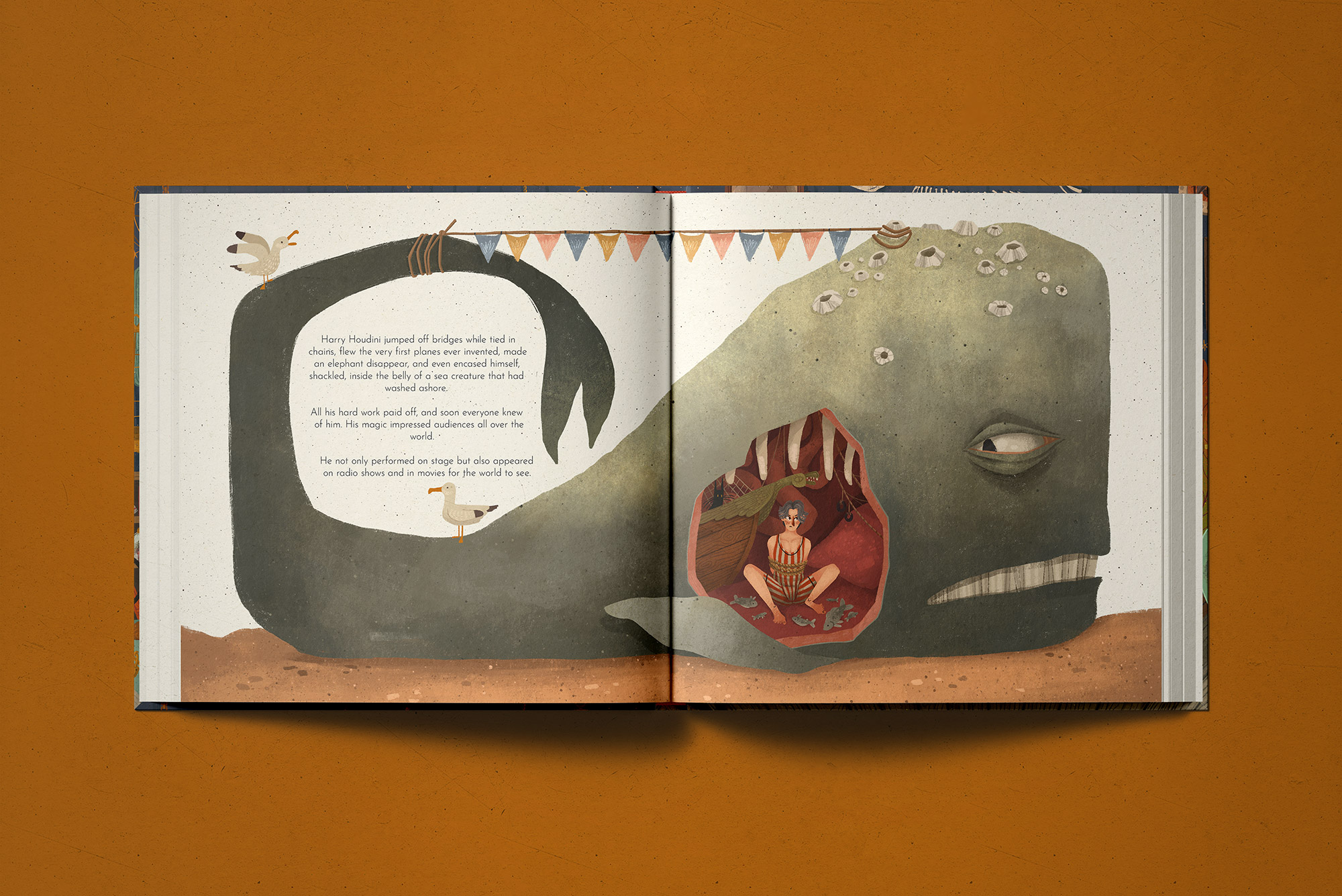 Interior spread from The Magical Manacles — a beached whale on sand with bunting strung along the loop of its tail, and Harry seated bound in rope inside a cutaway of its belly