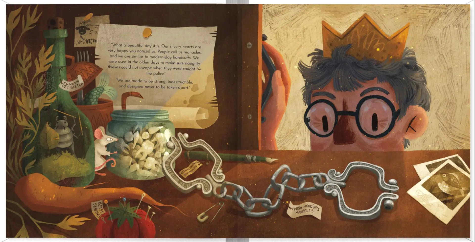 Interior spread from The Magical Manacles — Houdini's manacles laid on a desk in a curiosity-filled workshop